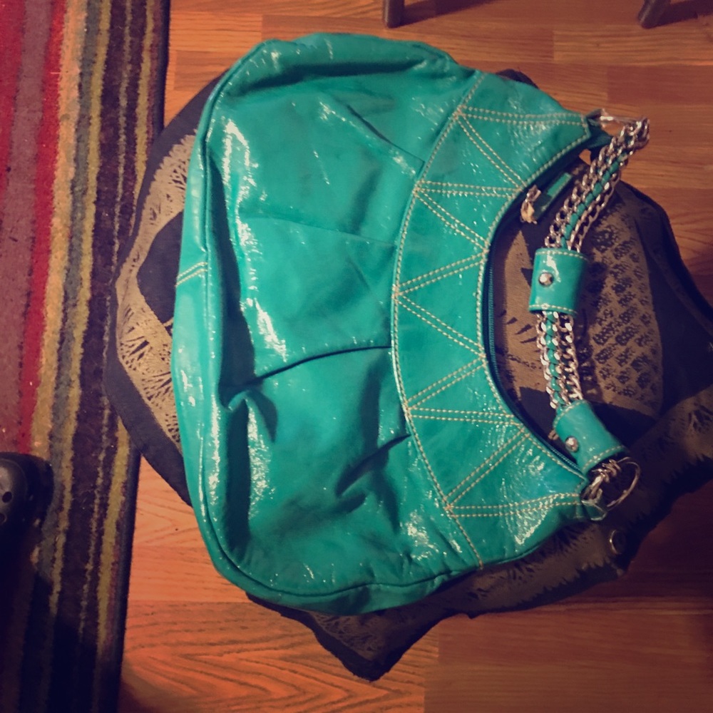 2 handbags . One blue & a snakeskin type pattern.